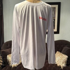 Bacardi brand. NWT XL never worn moisture wicking style long sleeve shirt.